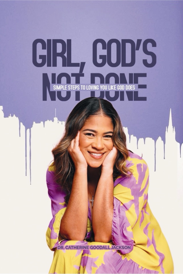 Cover of Girl, God’s Not Done. Cathy Goodall-Jackson rests her chin on both hands, smiling, in a purple and yellow print dress against a violet ground.